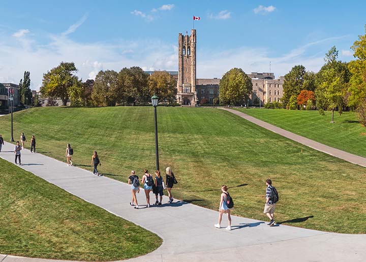 Students walking by UC tower at Western Campus